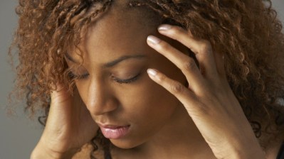 Studio Portrait Of Stressed Teenage Girl